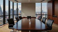 an empty conference table with black chairs in front of large windows overlooking cityscape