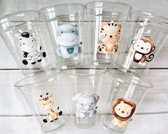 six clear cups with different animal designs on them