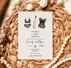 an image of a wedding card with two dresses on it and pearls around the edges