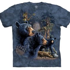 two bears in the woods on a blue tie - dye t - shirt with trees and bushes behind them