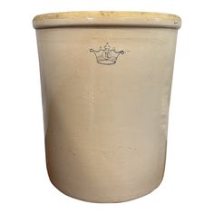 a large white pot with a crown on the front and bottom, is shown against a white background