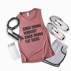 a woman's pink tank top with the words kinda wanna workout, kinda wanna eat tacos