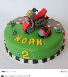 a green cake with a motorcycle on it and the words noah 2 written in yellow