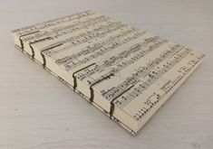 several sheet music notes are stacked on top of each other