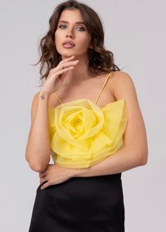 Inject a touch of timeless sophistication into your wardrobe with this delightful Organza Flower Detail Crop Top. Delicate spaghetti straps and a vibrant yellow hue combine with captivating organza flower detail to create an exquisite, show-stopping piece. Perfect for elevating any outfit. Fabric: polyester fiber Spring Wedding Camisole With Spaghetti Straps, Floral Print Camisole With Spaghetti Straps For Parties, Spring Wedding Camisole With Delicate Straps, Floral Print Cami Camisole For Party, Party Camisole With Floral Print, Spring Party Camisole In Feminine Style, Spring Party Camisole With Feminine Style, Summer Party Floral Print Camisole, Spring Party Feminine Camisole