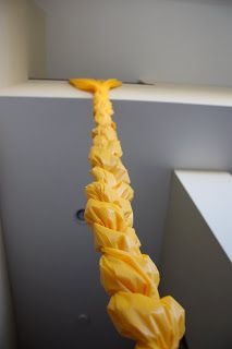 a long yellow piece of paper hanging from the ceiling