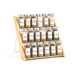 the spice rack is holding many different types of spices