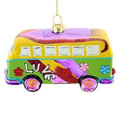 a colorful bus ornament hanging from a chain