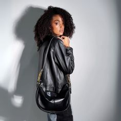 Our Hobo bag is the perfect accessory for those seeking a balance between style and functionality. This iconic curved design with a flexible structure fits comfortably on the shoulder, providing a feeling of lightness and comfort. Its versatile handle adjusts to your liking, allowing you to carry it as a short shoulder bag or crossbody, depending on the occasion.  With its relaxed silhouette and a touch of bohemian flair, this slouchy bag is ideal for those who appreciate fashion with a carefree air. Crafted from the highest quality leather, it is not only spacious and practical, but also a timeless piece that complements any style. The intricate and alluring hand-shaped hardware is inspired by palm reading and will surely captivate the imaginations of all who behold it. Exterior: Bovine s Versatile Saddle Bag For Everyday Use, Chic Everyday Saddle Bag With Zipper Closure, Modern Soft Leather Saddle Bag, Chic Everyday Flap Bag With Zipper Closure, Modern Everyday Saddle Bag With Single Strap, Modern Everyday Saddle Bag With Single Shoulder Strap, Modern Saddle Bag With Single Shoulder Strap, Versatile Saddle Bag With Single Shoulder Strap For Travel, Modern Everyday Flap Bag With Single Strap