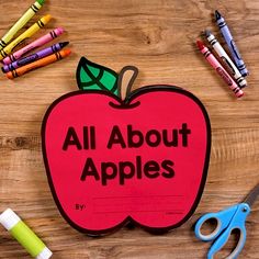 an apple with the words all about apples written on it next to crayons and markers