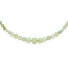 a green jade bea necklace on a white background