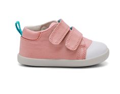 a child's pink and white sneaker with velcro straps