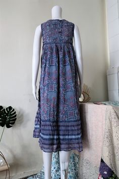 Beautiful True Vintage folklore dress from the 1970s or early 1980s. Midi length, comfortable light breezy cotton fabric with folklore print. A-line cut. Lined. Perfect for hot summer days. Made in India! ERA: 1970s, 1980s BRAND: Roshafi COLOUR: Different tones of blue, white, red FABRIC: 100% cotton SIZE: S - fits best size XS-S, please check the measurements below MEASUREMENTS: Pit to pit 39cm, total length 110cm CONDITION: Very good Vintage condition Folk Style Floral Print Maxi Dress, Cotton Bohemian Midi Dress With Boho Print, Bohemian Cotton Midi Dress With Boho Print, Peasant Style Cotton Dress With Boho Print, Cotton Boho Dress With Boho Print, Bohemian Cotton Peasant Dress, Cotton Peasant Dress With Boho Print, Bohemian Cotton Peasant Dress For Beach, Flowy Cotton Peasant Dress In Bohemian Style