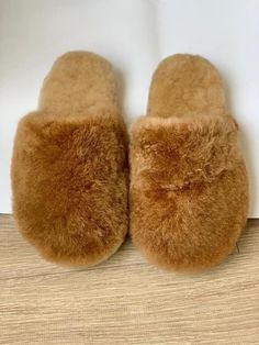 Alpaca fur slippers - alpaca slippers from Peru - unisex slippers - fur slippers - winter slippers - Gift for any occasion - fluffy fur slippers The unisex Luxurious Alpaca fur slippers keep your feet nice and cozy even on the most blustery winter's eve. These fur slippers are very well made, ensuring they will last for years. The best part is that these slippers are made from ethically-sourced alpaca fur, ensuring the highest quality and guilt-free comfort. With each step, you'll feel like you' Cozy Slip-on Slippers With Soft Texture, Cozy Soft Texture Slip-on Slippers, Comfy Faux Fur Slippers With Round Toe, Cozy Slippers With Soft Texture And Round Toe, Soft Texture Slip-on Winter Slippers, Winter Slippers With Soft Texture And Round Toe, Fluffy Slip-on Slippers For Indoor Use, Fluffy Slip-on Cozy Slippers, Fluffy Slip-on Indoor Slippers