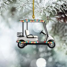 a golf cart ornament hanging from a christmas tree