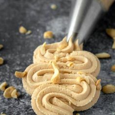 a cookie being frosted with peanut butter