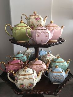 there are many different teapots on the table