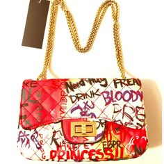 Quilted Graffiti Bag Gold Hardware 9 Inches By 6 Inches By 4 Inches. 20 In Shoulder Drop Chic White Bag With Letter Print, Chic White Bags With Letter Print, Chic White Shoulder Bag With Letter Print, Trendy White Shoulder Bag With Graphic Print, Casual White Shoulder Bag With Graphic Print, Red Rectangular Bag With Letter Print, Red Letter Print Bags For Shopping, White Graphic Print Shoulder Bag For Travel, Graffiti Bag