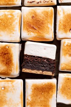 several squares of brownies with marshmallows on them