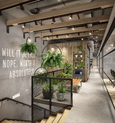 an office lobby with plants on the wall and wooden steps leading up to the second floor