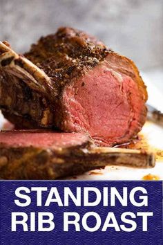 a piece of meat sitting on top of a white plate with the words standing rib roast