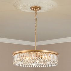 a chandelier hanging from the ceiling in a room