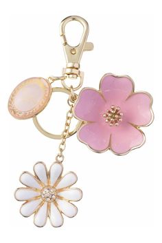 a pink and white flower shaped keychain on a gold plated metal chain