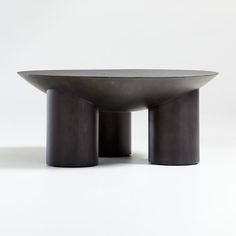 a black table sitting on top of a white floor