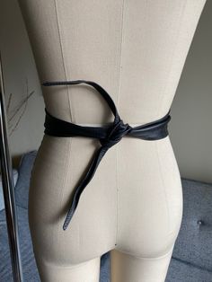 "Beautiful black leather beaded belt Features an ornate beaded pattern, black leather material, ties in the back, and a great style! Label: None Material: Leather Size Marked: None Estimated Size: 26\"-34\" waist Color: Black, Pink, Iridescent Condition: Excellent Length: 46\" total, great for 26\"-34\" waist Width: 3 1/2\"-widest point Measured flat, photographed on a size 6 form For more items: http://www.etsy.com/shop/wemovevintage All measurements are taken with the garment lying flat. Pleas Vintage Black Adjustable Belt, Adjustable Black Belt For Night Out, Black Corset Belt For Spring, Leather Party Belts, Black Leather Belts For Festivals, Black Leather Festival Belts, Black Leather Corset Belt With Belt Detail, Adjustable Black Belts For Parties, Adjustable Black Belts For Party