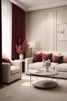 a living room filled with white furniture and red pillows