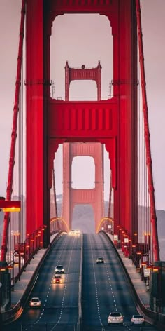 cars drive across the golden gate bridge in san francisco, california