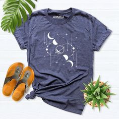 Moon shirt, Moon Phases shirt, Space moon shirt, Astrology Shirt, Astronomy shirt women, Moon Stars Shirt, Space Lover Gift, Celestial Shirt Hello! Thank you for supporting small businesses. My main priority here is the satisfaction of my customers. My t-shirts are Bella+Canvas brand. If Bella+Canvas is out of stock, I will send it from a brand of the same size and quality. If you want to see this design on the SWEATSHIRT you can buy it from the link below.https://etsy.me/3LS0Viz T-shirts are co Astronomy Shirt Design, Relaxed Fit Graphic Tee With Moon Print, Relaxed Fit Moon Print Graphic Tee, Celestial Short Sleeve Tops With Moon Print, Celestial Short Sleeve Cotton Tops, Celestial Style Cotton Tops With Short Sleeves, Picture Cube, Space Lovers Gifts, Moon Phases Shirt