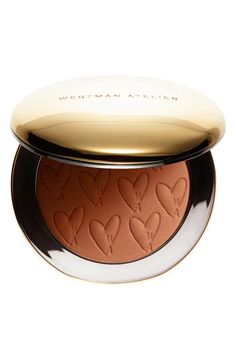 What it is: A clean, matte-finish bronzer that delivers a just-from-the-beach kiss of color to your skin.What it does: It's formulated with a buttery blend of nourishing ingredients that help boost skin's hydration, while innovative pigment technology protects from environmental stressors. Rich, natural terracotta tones leave skin looking healthy with an outdoorsy glow. Free of shimmer, it delivers a weightless, second-skin finish. How to use: Swirl your powder brush into the Powder Bronzer and Westman Atelier, Bronzer Makeup, Butter Bronzer, Powder Bronzer, Shimmer Makeup, Cupuacu Butter, Bronzing Powder, Cocoa Seeds, Beauty Lounge