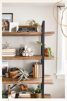 wood and metal bookshelf styled with plants, propagations, air plants, candles, old cameras, wood accessories, and vintage books Metal And Wood Shelves Living Room, Bookshelf For Kitchen Storage, Shelf Decor Industrial, Bookshelf Ideas Minimalist, 5 Shelf Bookshelf Styling, Industrial Shelf Styling, Boho Living Room Bookshelf, Minimalist Bedroom Shelf, What To Put On Bottom Shelf Of Bookcase