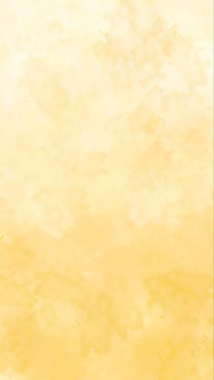 an orange and yellow watercolor background with small white dots on the bottom right corner