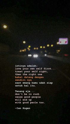 a blurry photo of cars driving down the road at night with text written on it