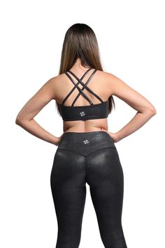 The Shine Liquid Bra combines functionality with a stylish twist, perfect for sports activities that demand both performance and flair. Made from a durable blend of 75% Nylon and 25% Elastane, it offers excellent stretch and support, ensuring comfort and freedom of movement during workouts. The distinctive glossy finish adds a touch of glamour, making it ideal for those who like their fitness gear to stand out. This bra is easy to care for, requiring a gentle wash and avoiding high heat, ensurin Sporty Medium Support Padded Activewear, Sporty Black Activewear For Light Exercise, Activewear With Built-in Padding And 4-way Stretch For Training, Fitted Padded Activewear Sportswear, Fitted Padded Sportswear Activewear, Padded Fitted Sportswear Activewear, Padded Nylon Activewear For Sports, Sporty Fitted Padded Activewear, Athletic Fit Nylon Activewear With Built-in Padding