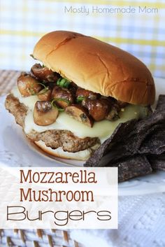 a close up of a sandwich on a plate with meat and mushrooms in the middle