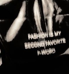 black and white photograph with words written on the back of a t - shirt that says fashion is my second favorite f word