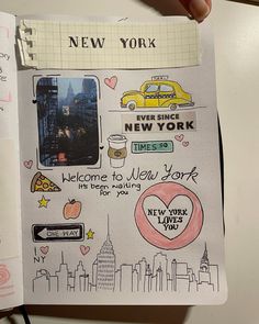 an open notebook with stickers on it and the words new york written in different languages