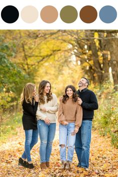 an image of three people standing in the leaves with their arms around each other and smiling