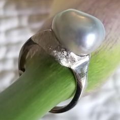 "* This beautiful pearl ring would be a wonderful gift to a bride on her wedding day, or perhaps the mother of the bride or groom! The silvery gray pearl is is unique and beautful, giving this ring tons of understated charm and elegance. This ring is very sturdy and well-made, and it shows! * This piece weighs 6.7 grams, and is stamped \"14K\" inside the shank. The pearls measure approximately 12.6 mm x 12.9 mm This ring is a US size 7. Please message us about sizing options prior to purchase! * Silver Akoya Pearl Ring For Anniversary, Formal Silver Pearl Drop Ring, Pear Shaped Silver Ring For Gift, Pear-shaped Silver Rings For Formal Occasions, Classic Tahitian Pearl Ring For Anniversary, Silver Pearl Drop Ring For Anniversary, Unique Silver Pearl Ring For Anniversary, Silver Pearl Drop Ring For Wedding, Silver Pear-shaped Rings For Formal Occasions