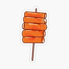 an orange lollipop sticker sitting on top of a white surface with no background