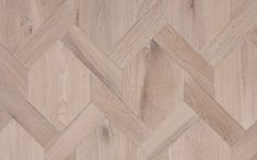 an image of wood flooring that looks like it is made out of herringbones