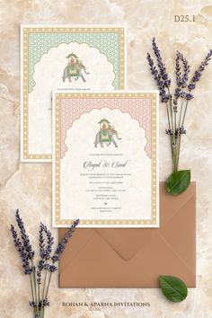 the wedding stationery is set on top of an envelope with lavenders and greenery