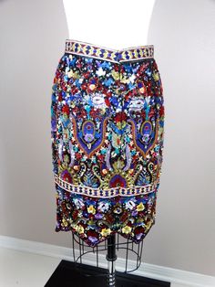 "This is a breath-taking vintage designer couture skirt! It's fully embellished with sequins, jewels and beading and is in perfect condition! Waist - 26\" Hips - 35\" Length - 22\" This item comes from a pet-free and smoke-free home. If you would like more info or have any questions, please don't hesitate to ask!" Embellished Fitted Skirt, Bohemian Fitted Skirt With Multicolor Embroidery, Fitted Bohemian Embellished Skirt, Glamorous Fitted Multicolor Skirt, Elegant Beaded Fitted Skirt, Elegant Fitted Beaded Skirt, Embellished Multicolor Skirt For Party, Festive Embellished Fitted Skirt, Multicolor Embellished Skirt For Parties