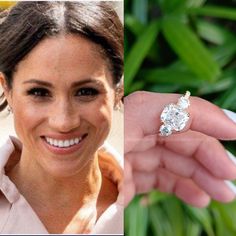 the engagement ring is being held up by a woman's hand