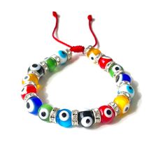 "Multicolor evil eye bracelet on adjustable red string with cz rings to add some glamorous bling Bracelet is made safe for you to get it wet so you can keep it on all the time Adjustable sliding knot will let you adjust the bracelet to a perfect fit Wrist size for women 5 inch to 7.5 inch Eyes are 8.5mm wide Handmade in USA 𝗢𝘃𝗲𝗿 𝟯𝟬𝟬 𝗲𝘃𝗶𝗹 𝗲𝘆𝗲 𝗯𝗿𝗮𝗰𝗲𝗹𝗲𝘁𝘀 𝗱𝗲𝘀𝗶𝗴𝗻𝘀 𝗵𝗲𝗿𝗲 https://etsy.me/3APq1sL 𝗣𝗿𝗼𝘁𝗲𝗰𝘁𝗶𝗼𝗻 𝗯𝗿𝗮𝗰𝗲𝗹𝗲𝘁𝘀 https://etsy.me/3KwQi3f 𝗦𝗲𝗻𝗱 𝗮 Adjustable Round Jewelry With Diamond Eyes, Multicolor Resizable Evil Eye Bracelet With Round Beads, Adjustable Evil Eye Bracelet With Colorful Beads, Adjustable Beaded Evil Eye Bracelet, Adjustable Evil Eye Jewelry Bracelet, Adjustable Spiritual Evil Eye Bracelet With Colorful Beads, Spiritual Adjustable Evil Eye Bracelet With Colorful Beads, Adjustable Evil Eye Beaded Bracelets, Adjustable Round Evil Eye Bracelet