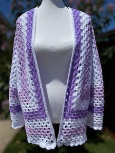 This cardigan is perfect for all occasions or just throw it on at the pool or beach. It can be dressed up or down. Extremely versatile statement piece Long Sleeve Shrug For Spring Beach Outings, White Oversized Cardigan For The Beach, Oversized White Cardigan For Beach, One Size Purple Spring Cardigan, One Size White Cardigan For Beach, One Size White Cardigan For The Beach, White One-size Cardigan For Beach, Purple Long Sleeve Cardigan For Summer, Lavender Granny Square