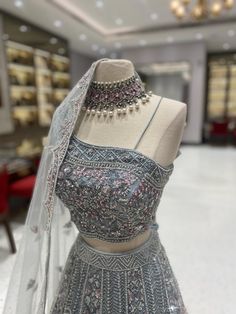 Elegant Unstitched Silver Lehenga, Designer Silver Lehenga With Sheer Dupatta, Silver Lehenga For Diwali Designer Wear, Designer Silver Lehenga With Intricate Embroidery, Designer Wear Silver Lehenga With Intricate Embroidery, Designer Silver Lehenga For Diwali, Silver Lehenga For Diwali, Silver Designer Lehenga For Diwali, Silver Floor-length Lehenga For Designer Wear